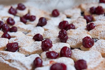 Cherry pie with heart shaped on the rustic background