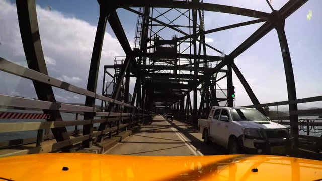 car driving across the bridge