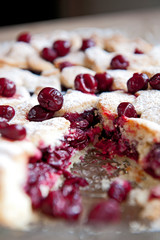 Cherry pie with heart shaped on the rustic background