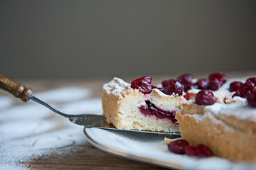 Cherry pie with heart shaped on the rustic background