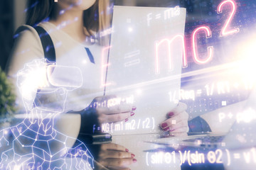 Science formula hologram over woman's hands taking notes background. Concept of study. Multi exposure