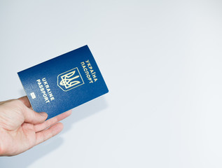 passport of Ukraine in hand