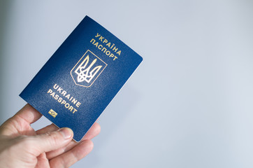 passport of Ukraine in hand