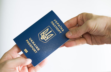 passport of Ukraine in hand