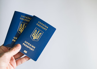 passport of Ukraine in hand