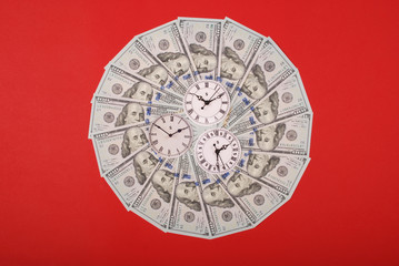 Concept of clock and dollar. Clock on mandala kaleidoscope from money. Abstract money background...