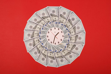 Concept of clock and dollar. Clock on mandala kaleidoscope from money. Abstract money background...