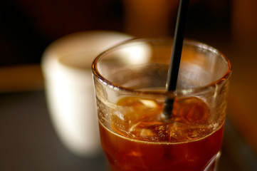 Ice coffee and straw after a sip.