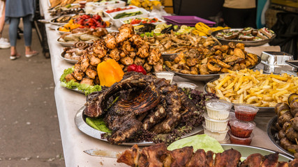 Grilled meat on the grill with fresh and grill vegetables. Street food