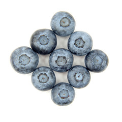 blueberries laid out in a diamond shape on a white background