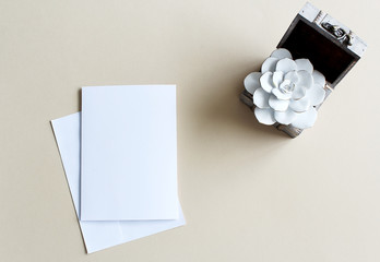 white paper on the table with flower