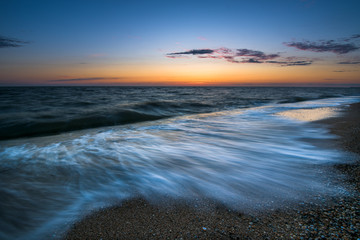 Obraz premium sunset view of the sea. long exposure, waves fuzzy