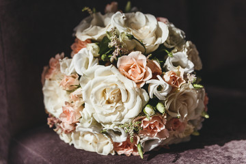 Round bouquet of white and peach roses