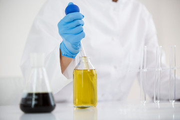 Scientist extracts pharmaceutical cbd oil in a laboratory