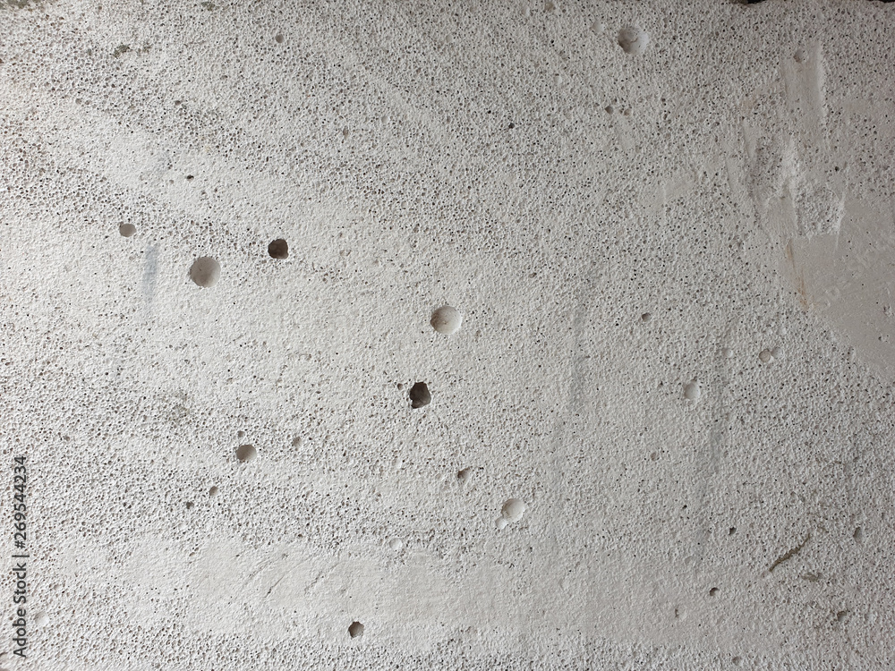 Poster close up view of grey texture of foam block cut