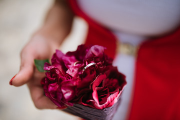 Wedding rings lie on a flower close up