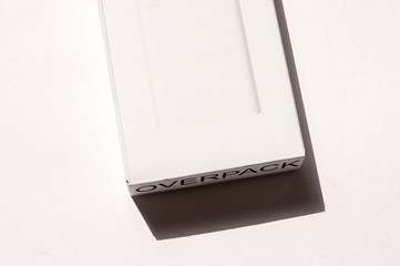 Empty power bank mockup blank box on the white textured background.