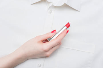 woman hand, holding lipstick, white, men's shirt, red manicure, background, copy space, for advertising, text, slogan, close up, top view