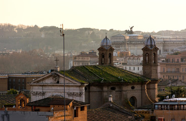 roofs of Rome at sunset, city view