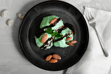 Set of ice cream scoops of different colors and flavours with berries, nuts and fruits