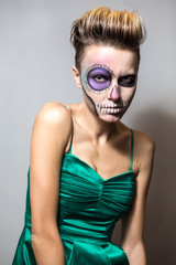 Portrait of beautiful woman with bright halloween makeup