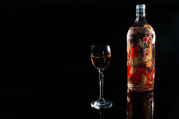bottle and glass of wine on table