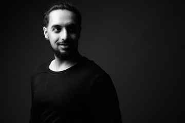 Young bearded Indian man in black and white