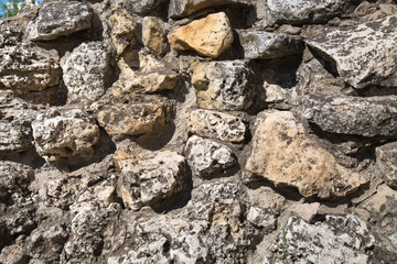 View of a wall of stones of irregular shapes Backgrounds textures for graphic design Wallpapers Wallpaper Abstract illustration of a natural stone