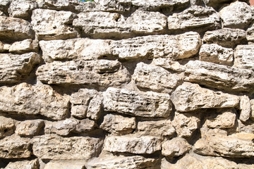 View of a wall of stones of irregular shapes Backgrounds textures for graphic design Wallpapers Wallpaper Abstract illustration of a natural stone