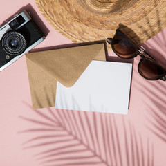 Summer vacation blank card composition. Tropical leaf shadow, camera, glasses