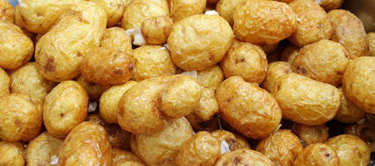 Fresh sauteed potatoes with garlic. Diet and healthy eating concept. Vegetarian food. Potato background texture.