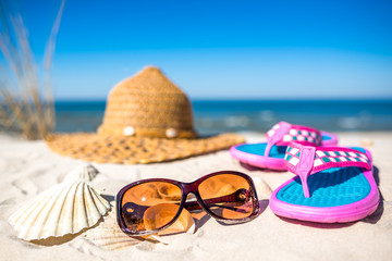 Holiday sea beach accessories, summer vacation background, Baltic Sea with blue sky, Poland