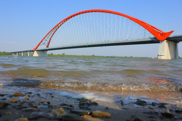 view from the shore to the arch of the bridge in novosibirsk