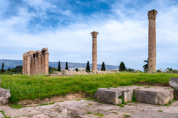 Athens, Attica / Greece. The Temple of Olympian Zeus also known as the Olympieion or Columns of the Olympian Zeus as seen from the west. Sunny day, blue cloudy sky, nobody