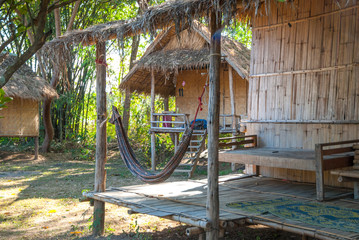 Fototapeta na wymiar Bamboo huts with hammock, Pai