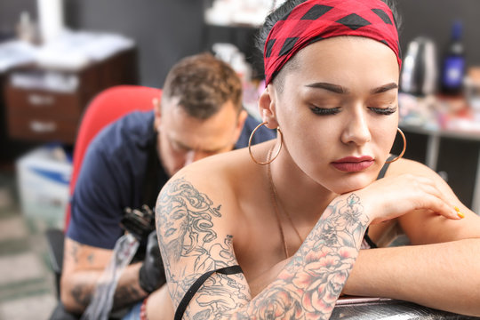 Female Client Getting Tattoo In Salon