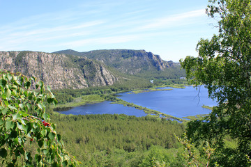 Fototapeta na wymiar view from the mountain to the lake pasha in karkaraly