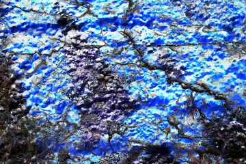 Detailed colorful painted concrete walls in a high resolution close up view