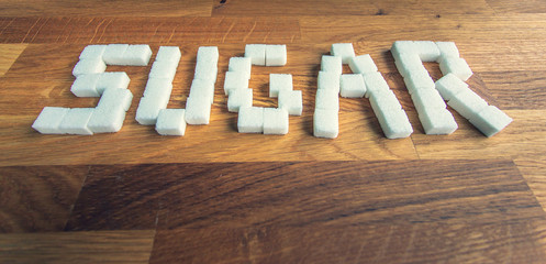 SUGAR text from sugar cubes.