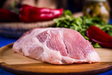 Raw pork on a wooden board