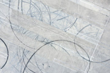 Aerial image tire skid marks in concrete parking lot
