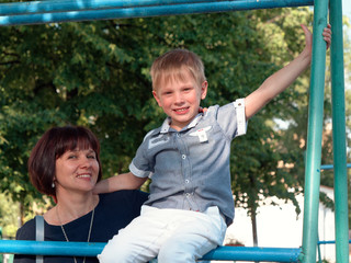 boy 6 years old sitting on the bar.