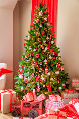 Fototapeta na wymiar Toys on the Christmas tree. Dressed up Christmas tree. New Year's decorations.