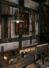 Joinery shop interior with rusty tools and equipment. Carpentry workshop business concept.