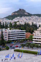 Athens, Attica / Greece - November 1, 2018: Athens city in Greece with Lycabettus Hill as seen from the vantage point of the Panathenaic Stadium (Kallimarmaro)