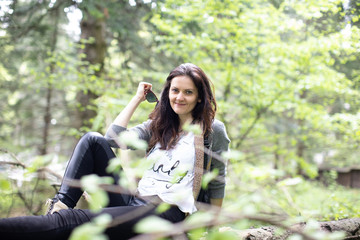 Young woman in the forest modelling