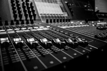 Closeup view of Faders on Professional digital Audio Sound  mixing control Console