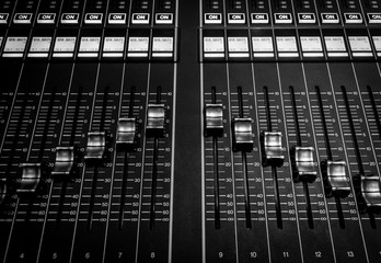 Closeup view of Faders on Professional digital Audio Sound  mixing control Console