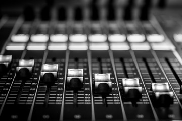 Closeup view of Faders on Professional digital Audio Sound  mixing control Console