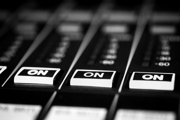 Closeup view of Faders on Professional digital Audio Sound  mixing control Console